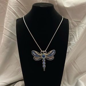 Dragonfly pendant with silver chain.